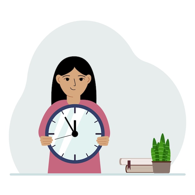 Una bambina tiene in mano un grande orologio Il concetto di organizzazione della pianificazione dello studio efficace dell'istruzione