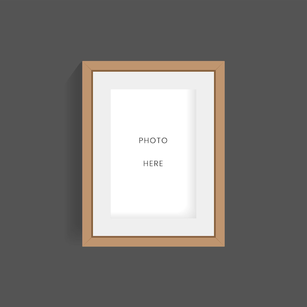 Una cornice di legno di foto su parete scura mock up design Cornice sul muro per foto luogo mock up vettore