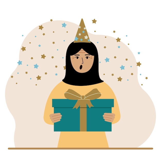 Una donna araba con un berretto festivo tiene una grande confezione regalo con un fiocco