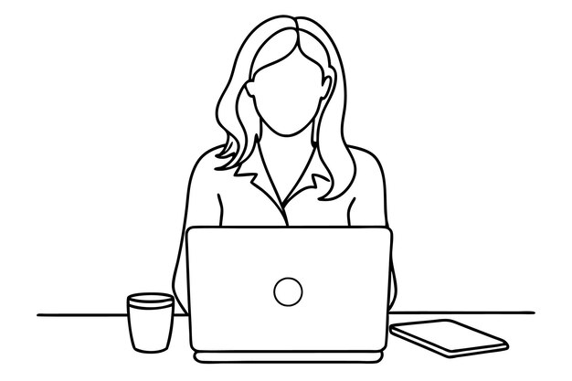 una donna si siede a una scrivania con un portatile e una tazza di caffè