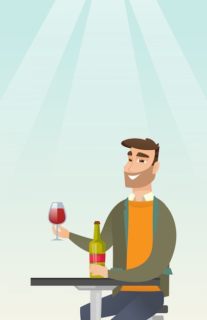 Uomo che beve vino nel ristorante.