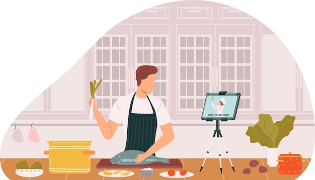 Uomo che cucina mentre guarda video di ricette tablet cucina preparazione cuoco domestico maschio prepara pesce impara