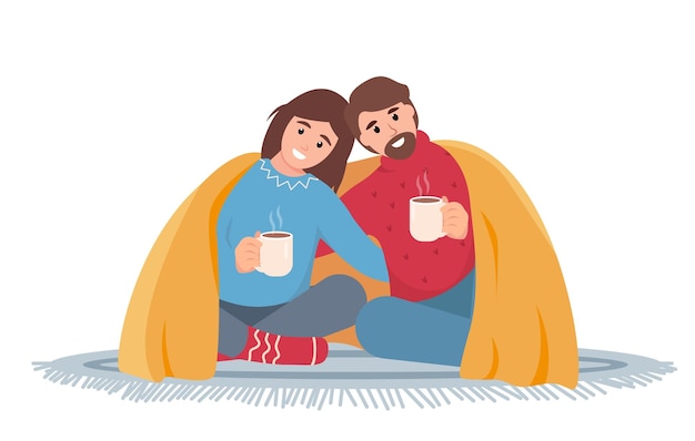 Uomo e donna felici con una bevanda calda sotto una coperta calda stagione invernale innevata accogliente o tempo freddo