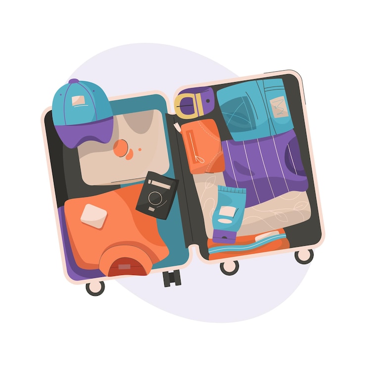 Valigia con vestiti confezionati per viaggiare in vista dall'alto
