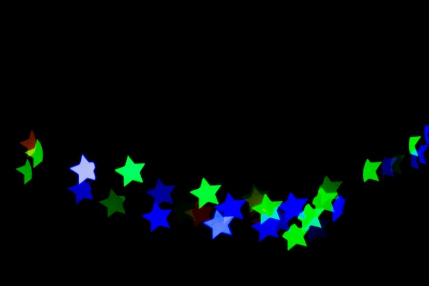 Gratis foto abstracte bokehachtergrond met ster gevormde lichten