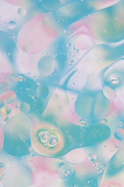 Abstracte bubbels over de blauwe en roze achtergrond textuur