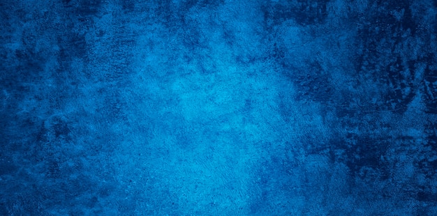Abstracte grunge decoratieve opluchting marineblauwe stucwerk muur textuur. brede hoek ruw gekleurde achtergrond