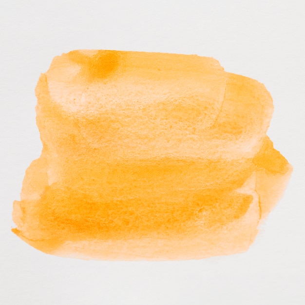 Abstracte oranje waterverfvlek als achtergrond op witte achtergrond