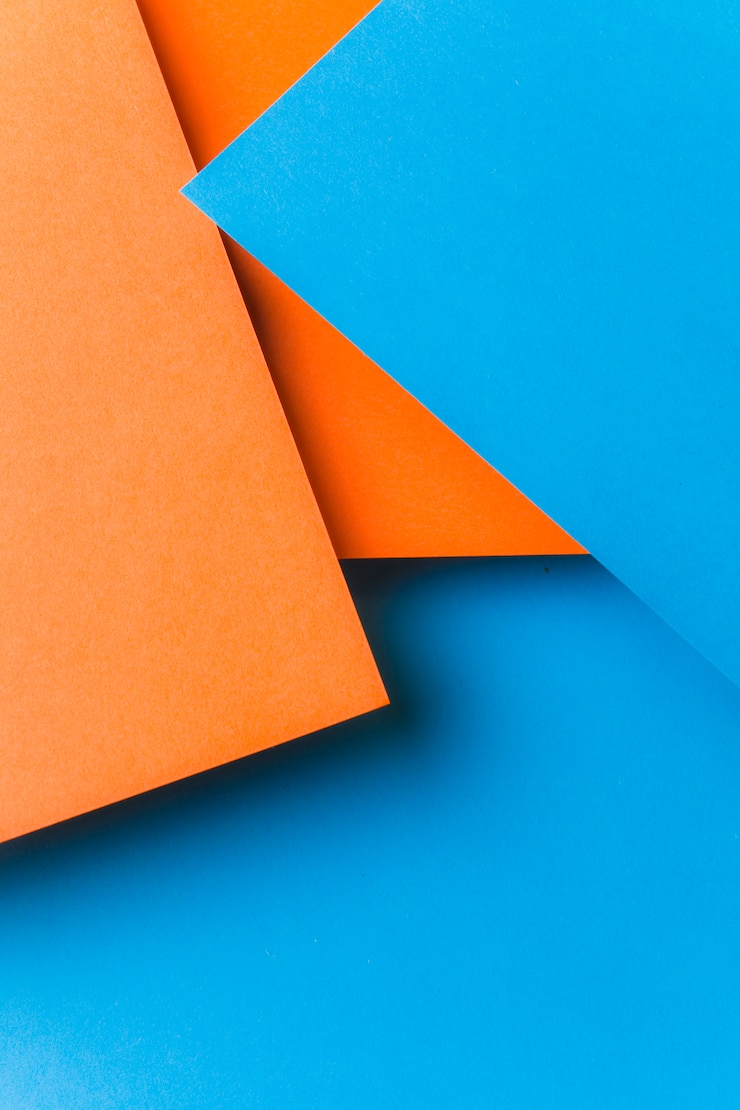 Gratis Foto achtergrond van blauw en een oranje papier