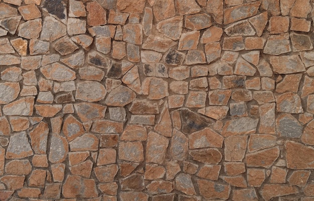 Gratis foto achtergrond van oude muur van onregelmatig gevormde stenen