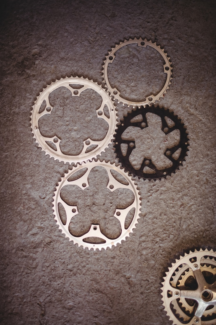 Gratis Foto bicycle gears op vloer