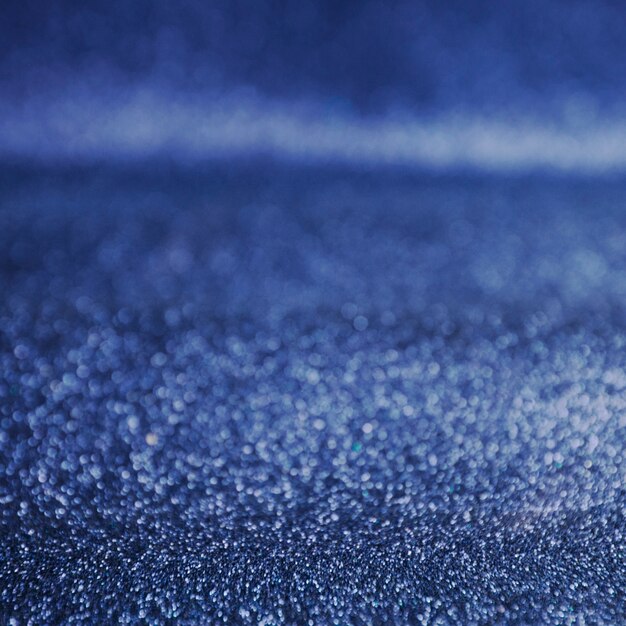 Blauw glitter bokeh lichten achtergrond