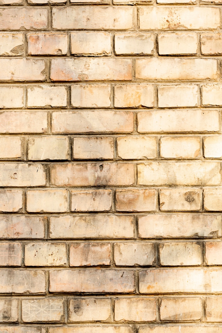 Gratis Foto blootgestelde vuile bakstenen muur
