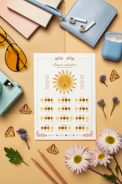 Gratis foto bovenaanzicht maankalender en bloemen