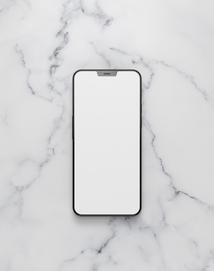 Gratis Foto bovenaanzicht smartphone op marmeren tafel