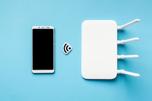 Bovenaanzicht van wifi-router met smartphone