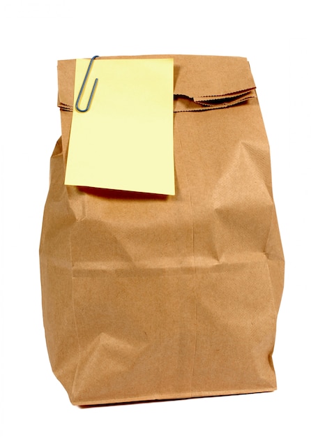 Bruine papieren zak met gele post-it stijl notitie
