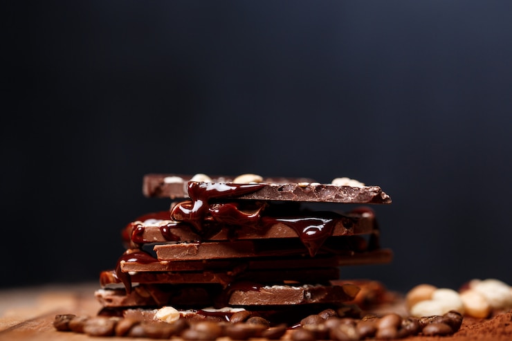 Gratis Foto chocolade en noten op zwart