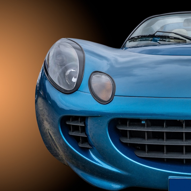 Gratis Foto close-up shot van de voorkant van een blauwe moderne stijlvolle auto