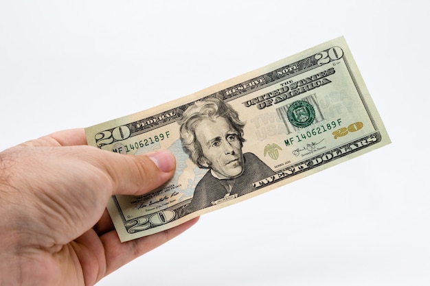 Close-up shot van een persoon met een dollarbiljet