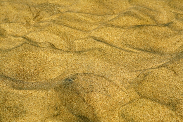 Close-up shot van verschillende patronen gemaakt van het zand