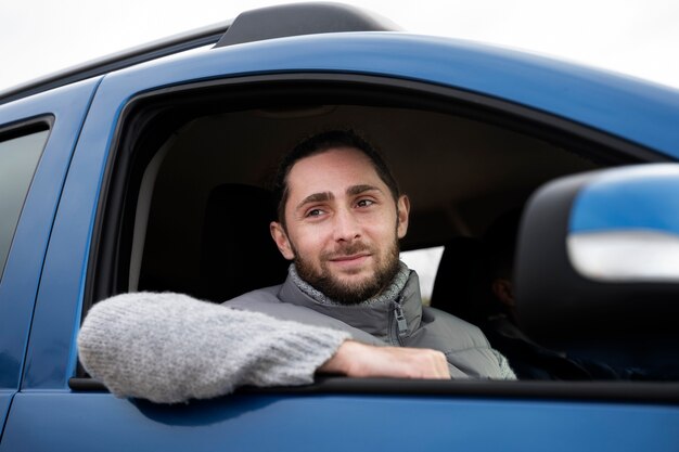 Close-up smiley man in auto