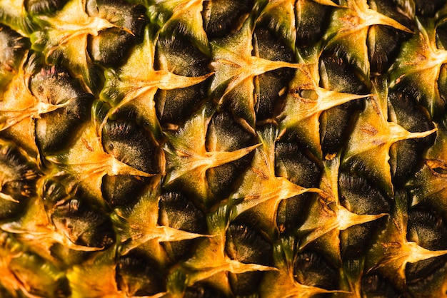 Gratis foto close-up van ananas schil achtergrond