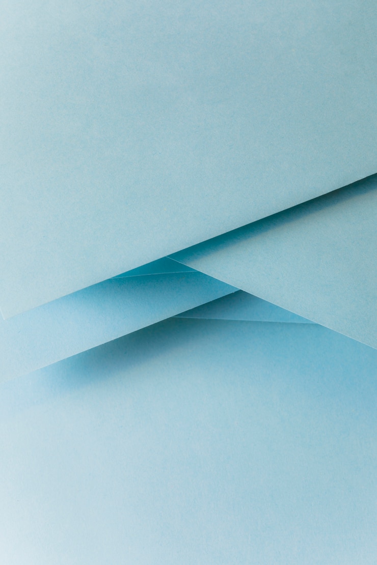 Gratis Foto close-up van pastel blauw gekleurd papier banner