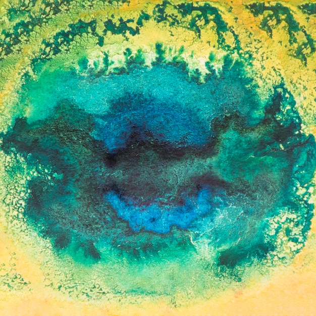 De bevlekte abstracte achtergrond van de waterverfverf