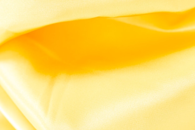 Gratis foto de gele stof van de close-uptextuur van kostuum