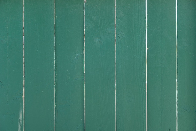 De groene houten achtergrond van de plankenmuur