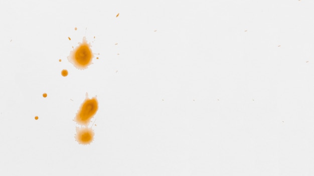De textuur van het document met oranje waterverfvlek