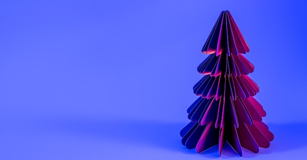 Gratis foto decoratieve papieren kerstboom op blauwe achtergrond met trendy neonlicht
