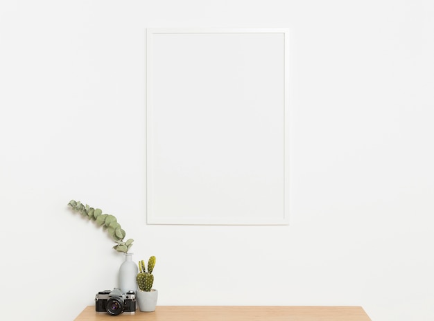 Gratis foto decoratieve plant met leeg frame