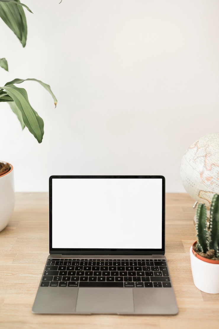 Gratis Foto desktop met laptop