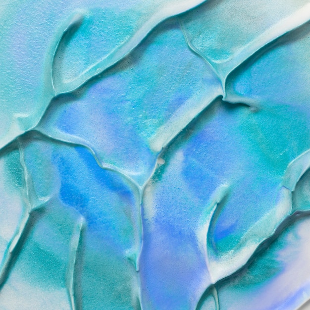 Gratis foto detailmening van turkooise en blauwe de textuurachtergrond van de waterverfverf