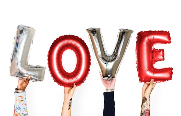 Gratis foto diversiteit handen houden van liefde ballon