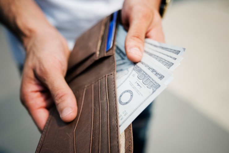 Gratis Foto een dollar biljetten in een portemonnee