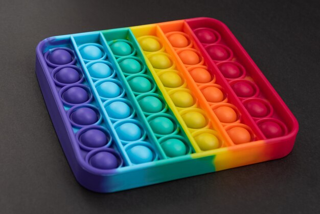 Fidget pop it speelgoed regenboogkleur - antistress, leuk en leerzaam