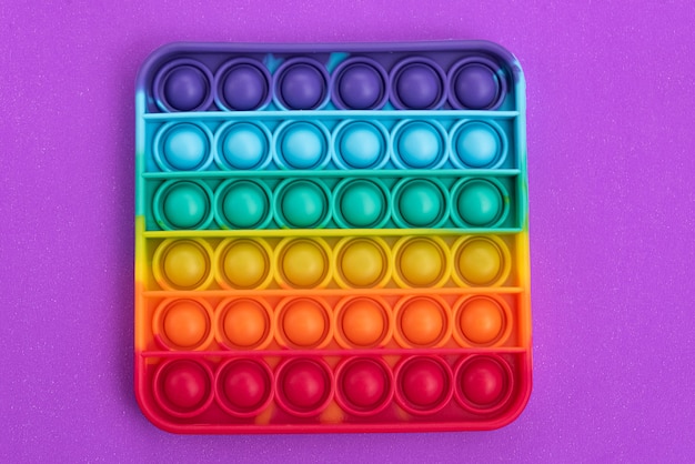Fidget pop it speelgoed regenboogkleur - antistress, leuk en leerzaam