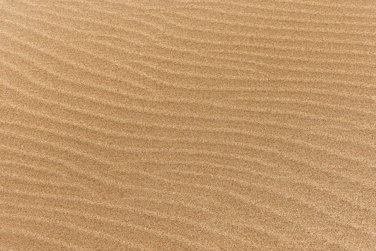 Gratis Foto fijn strandzand met golven