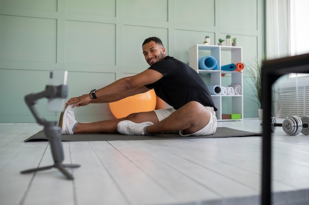 Full shot smiley man training op mat