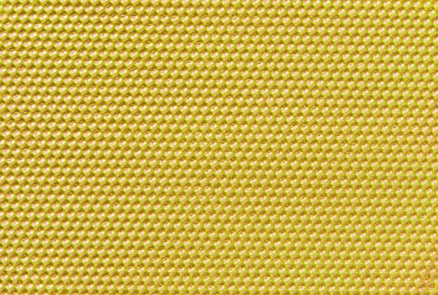 Geel gekleurde honingraatachtergrond