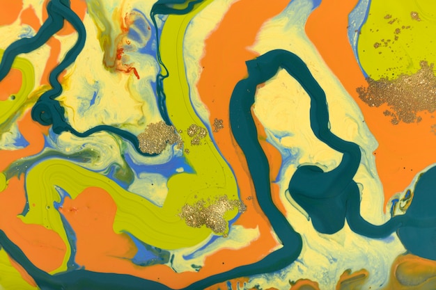 Geel, groen en oranje marmering vloeibare achtergrond. vloeiende kunst abstracte textuur. gemengde acrylinkt.