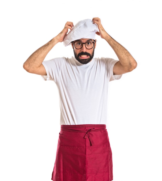 Gratis foto gefrustreerde chef-kok op witte achtergrond