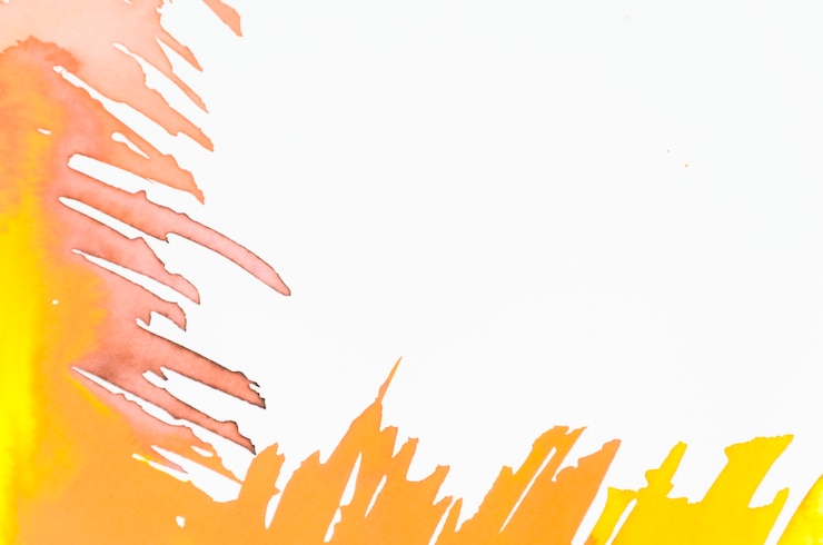 Gratis Foto gele en oranje penseelstreek op witte achtergrond