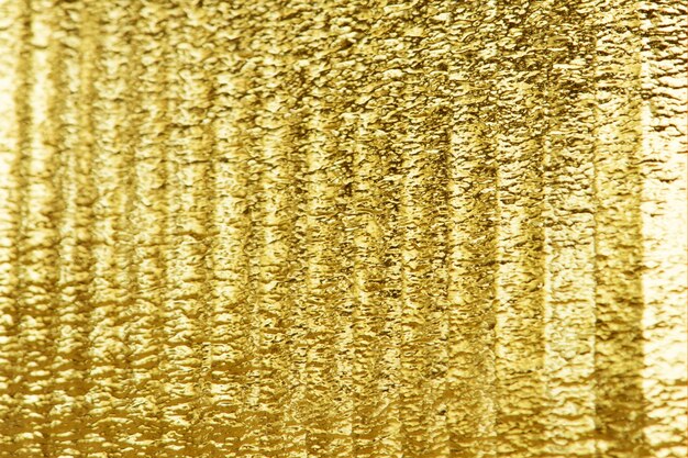 Glanzend goud getextureerde papier achtergrond