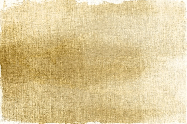 Gratis foto goud geschilderd op een gestructureerde achtergrond van stof