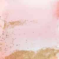 Gratis foto goud glitter op roze aquarel