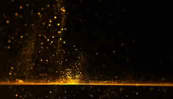 Gratis foto gouden deeltje stof poeder sparkle explosie achtergrond